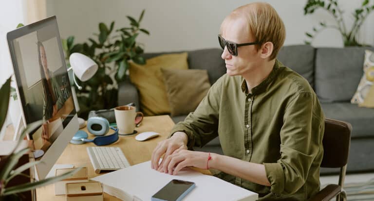 Man Reading Braille Book
